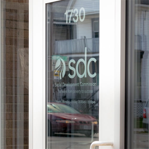 Social development commission door sign